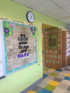 the hallway is decorated with colorful wallpaper and decorative decorations, along with a clock on the wall