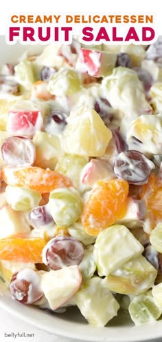 a white bowl filled with fruit salad on top of a table