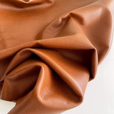 a close up view of a brown leather material