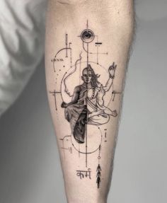 a man with a tattoo on his leg has an image of a woman sitting in yoga position