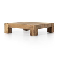 a coffee table made out of wood on a white surface with no one around it