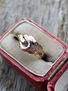 A beautiful solid 9 ct gold vintage ring. The band is solid 9 ct yellow gold with the knot rings fashioned in solid 9ct rose gold. A lovely mixed metal look. INTERNATIONAL BUYERS - please read the shipping information below. Follow us on Instagram for all our latest pieces and first Dibs! They don't all make it to our Etsy store: https://www.instagram.com/mooreperfectpieces/ Fully British Hallmarked - 375 hallmark,  denoting solid 9 ct gold, SJ makers mark Ring Size UK: L USA 5.75 EU 51 - resizing available for an additional fee - please get in touch before purchase Weight 1.5 g The face of the ring measures 8 mm Please be aware that we used a macro lens to photograph our item close up and allow you to see details, this may make them appear bigger on the screen than in person, so please ma Gold Knot Ring, Knot Ring, Macro Lens, Mixed Metals, Hallmark, Makers Mark, Vintage Rings, Fashion Rings, Etsy Store