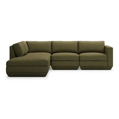 a green sectional couch with pillows on it