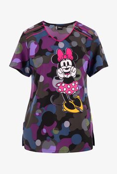 Tooniforms Disney s Minnie Mouse Dot s A Camo Women s 2-Pocket STRETCH V-Neck Print Scrub Top • Modern classic fit • V-neck rounded with contrast piping • 2 front side angled pockets • Short sleeve • Front shoulder yoke with contrast cover stitch • Side vents • Disney s Minnie Mouse signing a heart on a multi-color combo polka dot camo background • Approximate length for size M is 27 1 4 • Manufacturer style TF629-MNDM Made with a sustainable poly-spandex blend, our Tooniforms scrubs are the per Camo Background, Peds Nurse, Contrast Piping