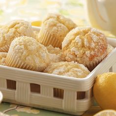 lemon muffins in a white basket on a table