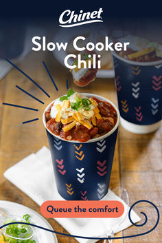 a bowl of chili is being served in a paper cup with the words slow cooker chili above it