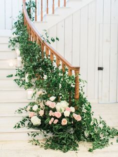 flowers and greenery are growing on the stairs