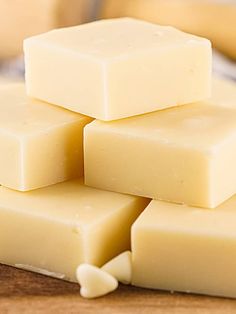 several pieces of soap sitting on top of a wooden table