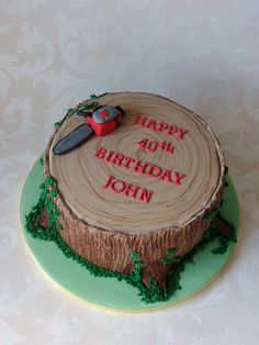 a birthday cake with a tree stump on it