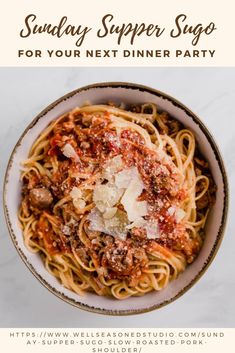 a white bowl filled with spaghetti and meat