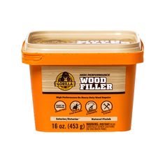 a container of wood filler on a white background