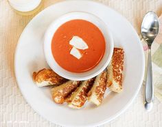 a white plate topped with soup and french toast