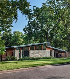 an image of a house with trees and grass in the front yard on instagram