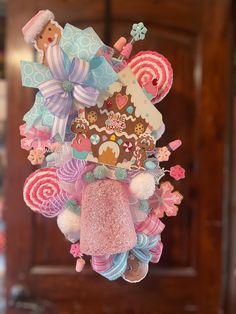 a christmas ornament hanging from the ceiling with candy and candies on it