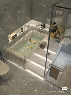 a bathroom with a large jacuzzi tub next to a toilet