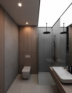 a bathroom with a toilet, sink and shower stall in the middle of it's floor to ceiling glass walls