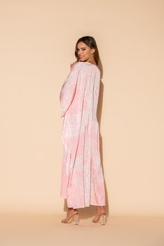 This damask print is a lovely combination of pale pink and white in our Romantique long caftan. The long, flowing caftan is made out of our signature Polysilk fabric for that all-day luxe vibe. Cover-up? Sure. Loungewear? Why not? Brunch with friends? Definitely. Sleepwear? Absolutely. Machine washable for ease of care. Elegant Pink V-neck Kimono, Elegant Pink Long Sleeve Kimono, Elegant Long Pink Thobe, Elegant Pink Kimono For Loungewear, Pink Elegant Kimono For Loungewear, Elegant White Kaftan For Daywear, Elegant Long Pink Kaftan, Pink Silk Maxi-length Kaftan, Spring Pink Kaftan For Loungewear