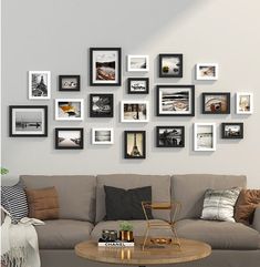 a living room filled with furniture and framed pictures on the wall above it's coffee table