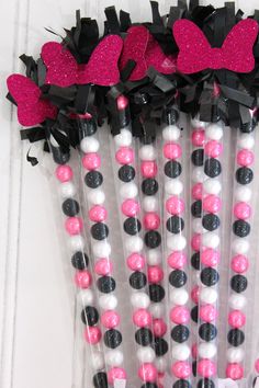 pink, black and white candy sticks with hearts on them