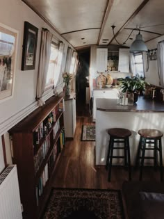 the inside of a house with two stools