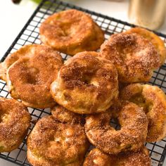 a bunch of doughnuts that are on a cooling rack