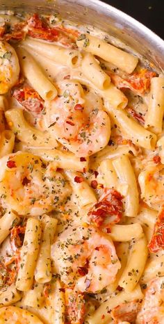 pasta with shrimp and tomato sauce in a pan