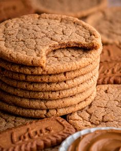 several cookies stacked on top of each other with peanut butter in the middle and one cookie sitting next to it