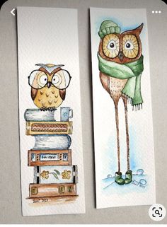 two bookmarks with watercolor drawings of an owl and a bird on top of books