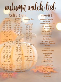 an autumn watch list with pumpkins and leaves on the table in front of them