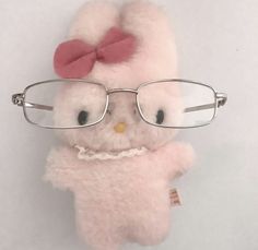 a stuffed animal with glasses on it's head