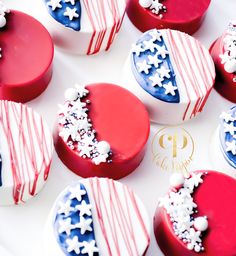 red, white and blue cupcakes with stars on them sitting on a plate