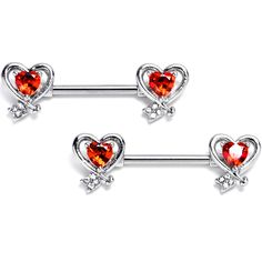 two heart shaped piercings with crystal stones in the middle and an arrow on each side