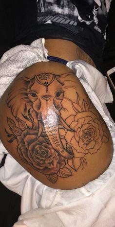 an elephant with roses on it's stomach is shown in this tattoo style photo