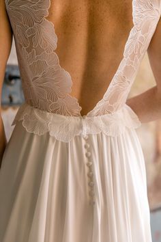 the back of a woman's wedding dress