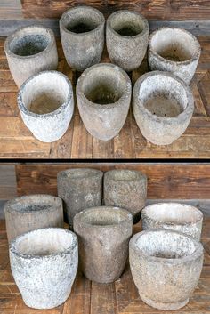 several cement pots sitting on top of a wooden floor next to each other in different positions