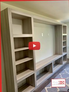 an empty room with shelves and carpeted flooring