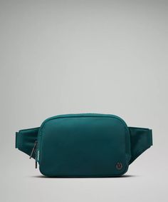 a green fanny bag on a grey background