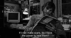 a man reading a book in the dark with a caption that reads, if i can make scars, do i have the power to heal them?