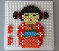 the bead art is designed to look like a girl