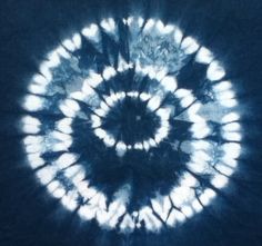 a blue and white tie - dye pattern is shown in the middle of this image