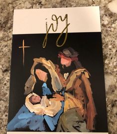 a painting of a man holding a baby in his arms with the word joy written on it