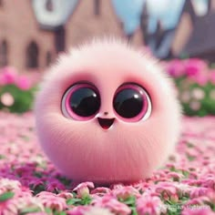 a pink ball with big eyes sitting in the middle of flowers