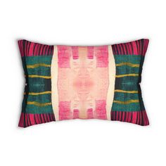 a pink, green and yellow striped pillow on a white background with an abstract design