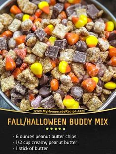 a bowl filled with halloween candy mix on top of a table