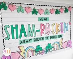 a bulletin board is decorated with shamrocks and st patrick's day signs on it