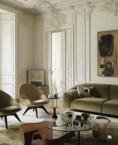 a living room filled with lots of furniture and walls covered in white painted plaster paint