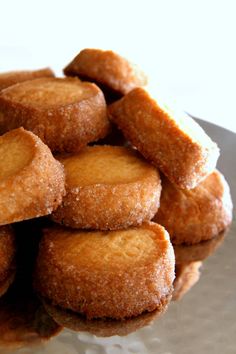 a pile of doughnuts sitting on top of a plate