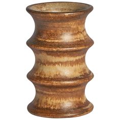 a wooden vase is shown against a white background