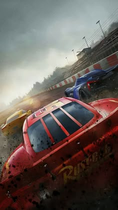 two racing cars in the middle of a race track with mud all over their tires