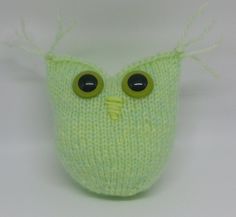 a green knitted face with two eyes